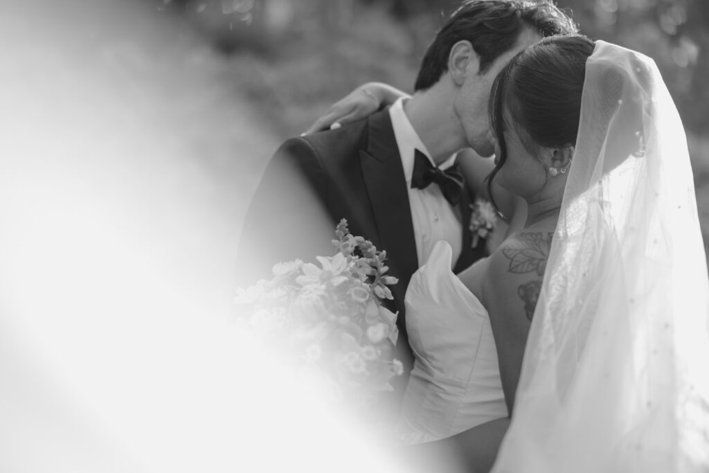 Black and white wedding portrait of a couple, part of a West Coast wedding budget guide by Dani Rawson Photo.
